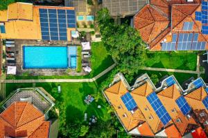 an overhead view of a house with a swimming pool at Seahorse Hotel & Spa in Negombo