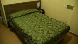 Letto o letti in una camera di Hotel Due Pini