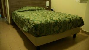 Letto o letti in una camera di Hotel Due Pini