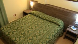 Letto o letti in una camera di Hotel Due Pini
