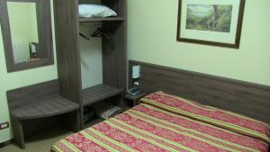 Letto o letti in una camera di Hotel Due Pini