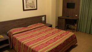 Letto o letti in una camera di Hotel Due Pini