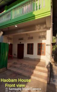 a front view of a front porch of a house at Haobam House in Imphal