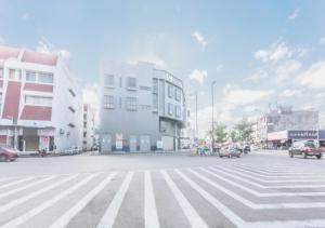 a city street with buildings and a crosswalk at GM Hotel Kuantan in Kuantan