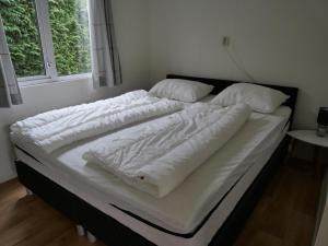 Postel nebo postele na pokoji v ubytování chalet lizzy + 16 fotografií