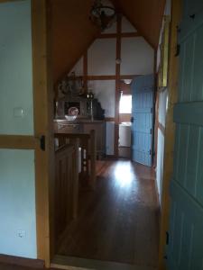 a kitchen with a table and a stove in a room at Ferienhaus Brotenfeld in Brotenfeld
