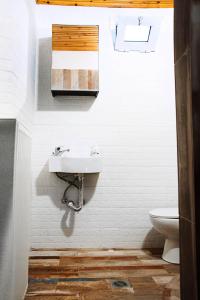 a bathroom with a sink and a toilet at SWEET HOME, LOUTRA POZAR in Dorothéa