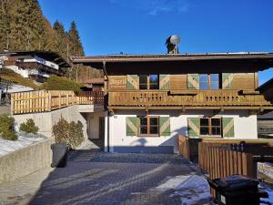 a house with a porch and a balcony at Haus Ingrid in Kitzbühel