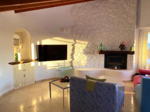 A television and/or entertainment centre at Casa Puput