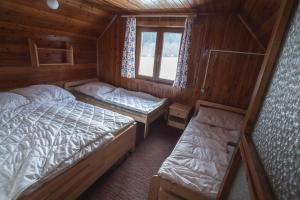 Postel nebo postele na pokoji v ubytování Chata Smiech