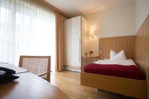 Postel nebo postele na pokoji v ubytování Seehotel Rheinsberg