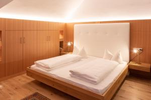 Postelja oz. postelje v sobi nastanitve Hotel Baur Am See