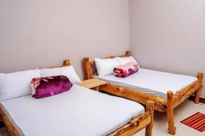 Ένα ή περισσότερα κρεβάτια σε δωμάτιο στο Wanyama B&B +12 φωτογραφίες