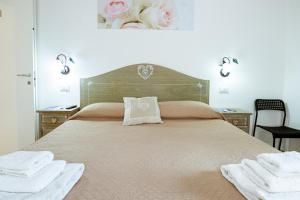 Posteľ alebo postele v izbe v ubytovaní "6 in centro" guest house
