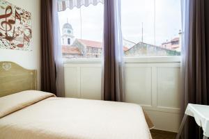 Posteľ alebo postele v izbe v ubytovaní "6 in centro" guest house