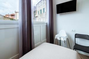 Televízia a/alebo spoločenská miestnosť v ubytovaní "6 in centro" guest house