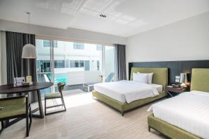 Postel nebo postele na pokoji v ubytování S Ram Leisure Hotel SHA PLUS