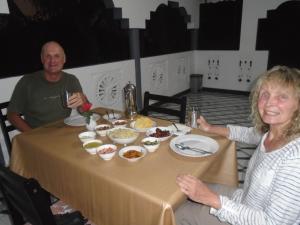 a man and a woman sitting at a table with food at El Shaddai in Mannar