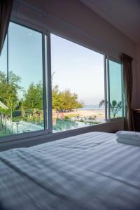 Postel nebo postele na pokoji v ubytování Seaman Resort