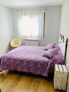 Ein Bett oder Betten in einem Zimmer der Unterkunft Apartamentos Maladeta