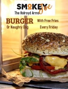 a hamburger with cheese and vegetables on a bagel at The Holroyd Arms in Guildford