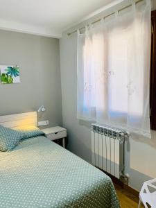 Ein Bett oder Betten in einem Zimmer der Unterkunft Apartamentos Maladeta