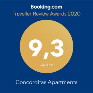 a yellow circle with the number nine and the text travelling review awards at Concorditas Apartments in Vienna