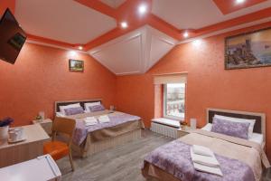 Кровать или кровати в номере Гостиничный комплекс Линь