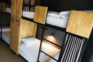 a couple of bunk beds in a room at Ray Hostel in Chiang Mai