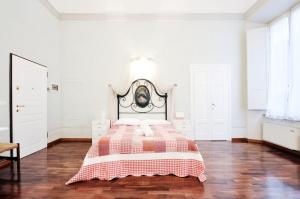 Uma cama ou camas num quarto em Tornaquinci Palace