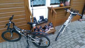 two bikes are parked next to a house at Apartamentai Alyvu 14 Palanga in Palanga