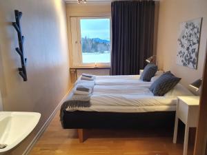 Ένα ή περισσότερα κρεβάτια σε δωμάτιο στο Millestgården Eco lodge