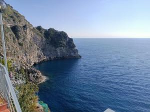 a view of the ocean from a cliff at Villa Eris Amalfi Coast in Conca dei Marini