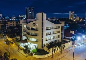 a building in the city at night at Mai Suites Apart Hotel in Santa Cruz de la Sierra