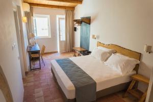 Postel nebo postele na pokoji v ubytování Masseria Testaferrata + 37 fotografií