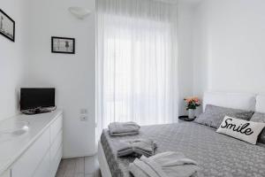 A bed or beds in a room at Stupendo e accogliente apt (15 min dal Duomo)