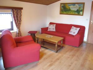 A seating area at Ospitalità Diffusa Laste Dolomites - Cèsa Murer