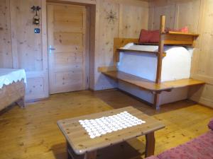 A bed or beds in a room at Ospitalità Diffusa Laste Dolomites - Cèsa Murer
