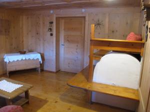 A bed or beds in a room at Ospitalità Diffusa Laste Dolomites - Cèsa Murer
