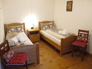 A bed or beds in a room at Ospitalità Diffusa Laste Dolomites - Cèsa Murer