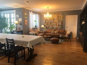 a living room with a couch and a table at The White House in Reykholt
