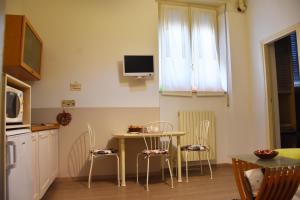 Kuchyň nebo kuchyňský kout v ubytování B&B via Roma