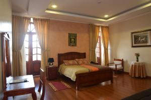 Un pat sau paturi într-o cameră la Hotel Casa Montero