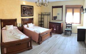Postel nebo postele na pokoji v ubytování La Casita del Guarda + 24 fotografií