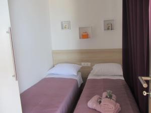 Postel nebo postele na pokoji v ubytování Mobile home Opal 1
