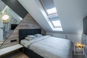 Posteľ alebo postele v izbe v ubytovaní Apartamenty Premium New