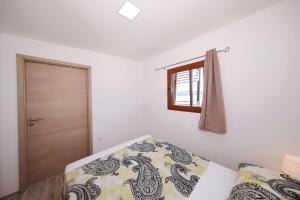 Posteľ alebo postele v izbe v ubytovaní Mobile home Plumeria 3