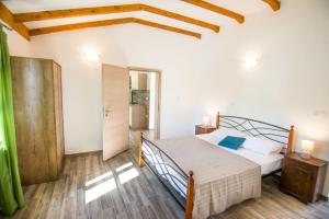 Posteľ alebo postele v izbe v ubytovaní Apartments Tarragon