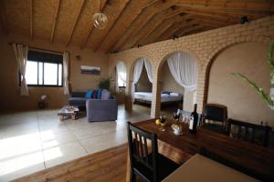 a living room with a couch and a table at Skyline in Mitzpe Ramon