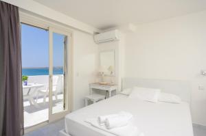 A bed or beds in a room at Soula Naxos